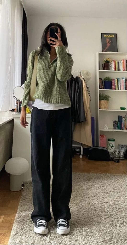 Green sweatshirt + white top + black jeans